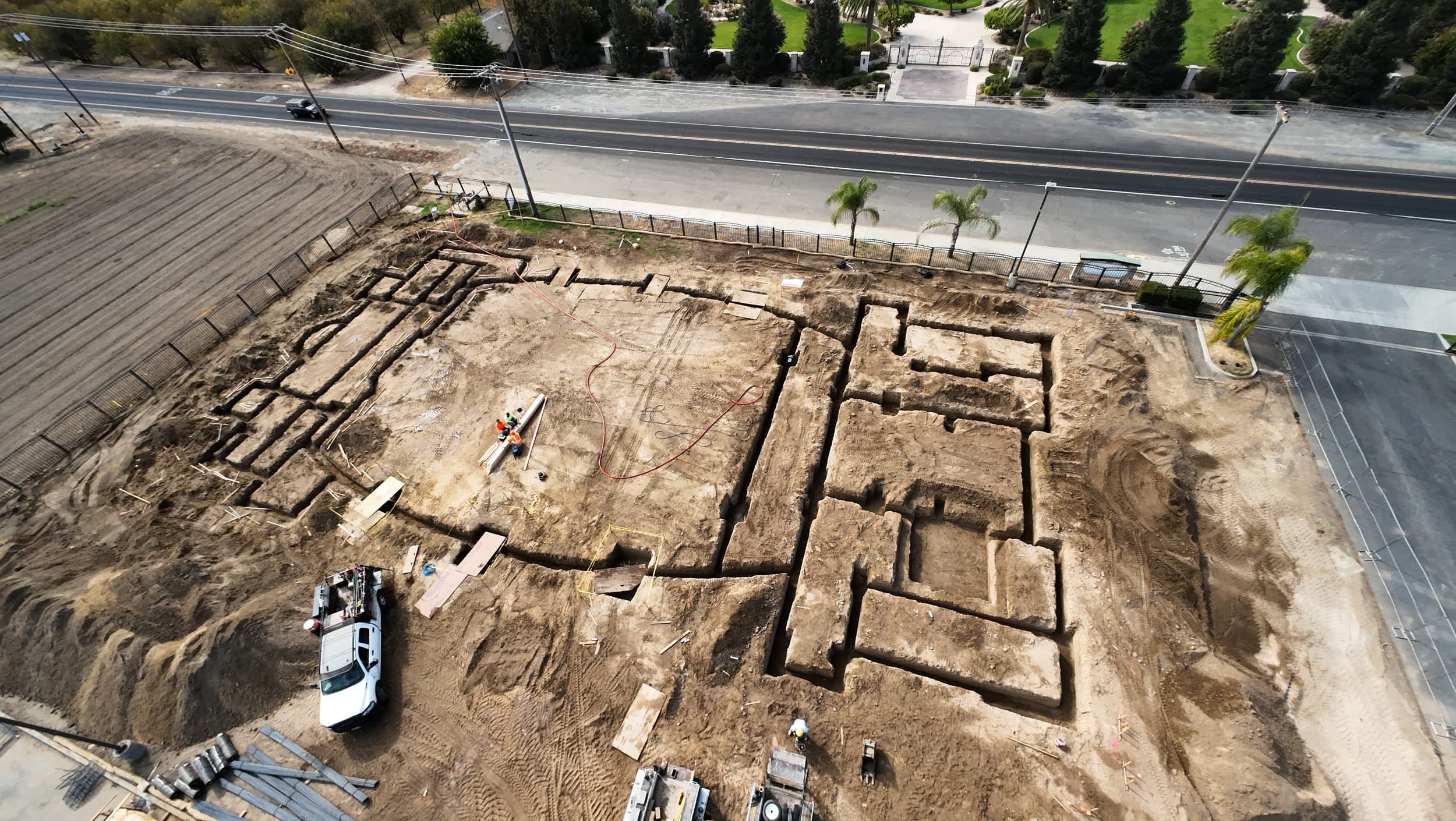 Aerial view of excavated foundation trenches outlining the new Mar Addai Church building footprint